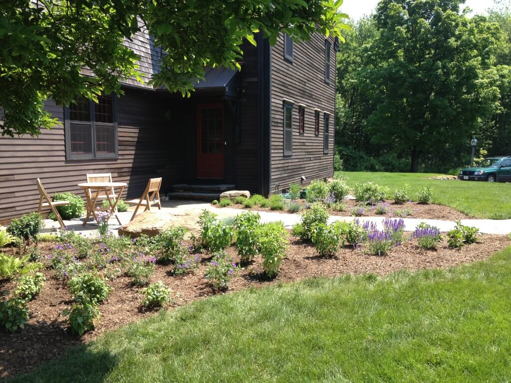 Entry Garden and patio with table and chairs in Amherst, MA